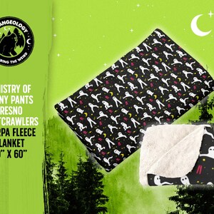 May include: Black sherpa fleece blanket with a pattern of white nightcrawlers, yellow moons, and red lines. The blanket measures 50" x 60". The text "MINISTRY OF FUNNY PANTS FRESNO NIGHTCRAWLERS SHERPA FLEECE BLANKET" is also visible.
