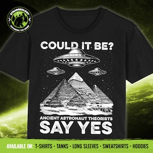 May include: Black t-shirt with a white graphic of pyramids and UFOs. The text "Could it be? Ancient Astronaut Theorists Say Yes" is printed on the shirt.