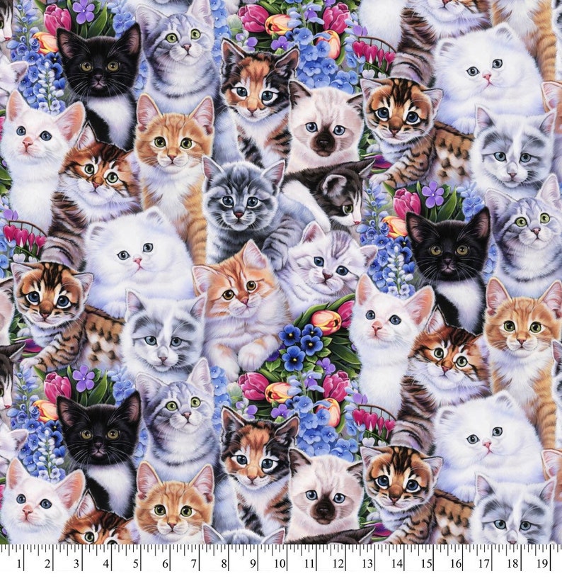 May include: A colorful fabric featuring a repeating pattern of adorable kittens in various poses and colors, surrounded by a floral design of blue, purple, and pink flowers.