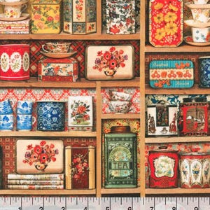 May include: A collection of vintage tea tins, cups, and trays arranged on wooden shelves. The items feature floral designs in various colors, including red, yellow, and blue. Some tins have text that reads "TEA".