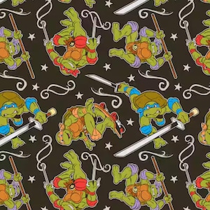 May include: A repeating pattern featuring the Teenage Mutant Ninja Turtles in various action poses. The turtles are green with colored masks and protective gear, set against a black background with white stars and swirls. Weapons include swords and bo staffs.
