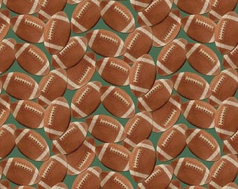May include: A repeating pattern of brown American footballs on a solid green background. Each football features a textured brown surface with white laces and white stripes at both ends, arranged in various orientations across the entire surface.