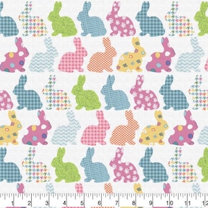 May include: A white fabric with a repeating pattern of colorful patchwork bunnies. The bunnies are in various poses and have different patterns, including plaid, polka dots, and floral prints.