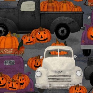 May include: A vintage white pickup truck with pumpkins in the bed, surrounded by other trucks and pumpkins. The trucks are decorated with Halloween themes. The text "The Pumpkin Patch" is visible on a wooden cart.