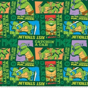 May include: Green fabric with a repeating pattern of Teenage Mutant Ninja Turtles characters. The characters are in various poses, including running, jumping, and fighting. The fabric also features the text "We Run This City!" and "Just Strollin' Catchin' A Cab!"
