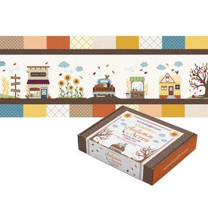 May include: A rectangular cardboard box for a Kimberbell Autumn Acres bench pillow fabric kit by Maywood Studio. The box features a brown and white design with a graphic of a truck, trees, and text. Above it is a long fabric strip with a patchwork border and a scene of a general store, sunflowers, a truck, a cider stand, and a house.