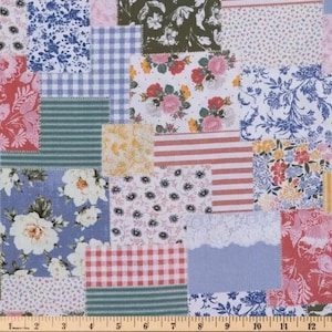 May include: A patchwork fabric with a variety of floral, striped, and gingham patterns in shades of pink, blue, green, and white. The fabric is composed of various rectangular and square patches, creating a quilt-like appearance. A ruler is at the bottom.
