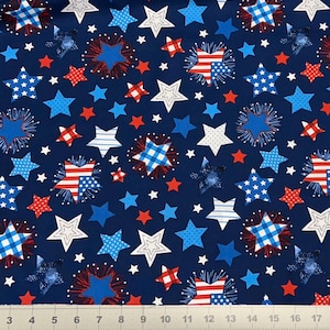 May include: A navy blue fabric with a repeating pattern of red, white, and blue stars. The stars vary in design, including stripes, polka dots, and solid colors. Some stars are surrounded by a burst-like design.
