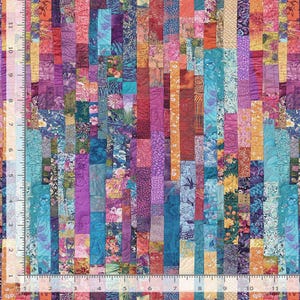 May include: A colorful patchwork fabric with vertical strips in shades of blue, purple, orange, and pink. The fabric has a ruler printed along the left edge, with measurements in inches. The design features floral and abstract patterns.