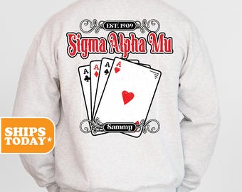 May include: Gray sweatshirt with a black and white graphic of playing cards and the text "Sigma Alpha Mu Est. 1909" and the name "Sammy" on the cards.