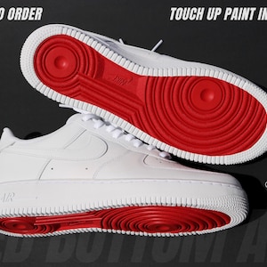 May include: White sneakers with red soles. The shoes have a classic design with a white upper, laces, and a red sole. The image includes the text "MADE TO ORDER" and "TOUCH UP PAINT INCLUDED".