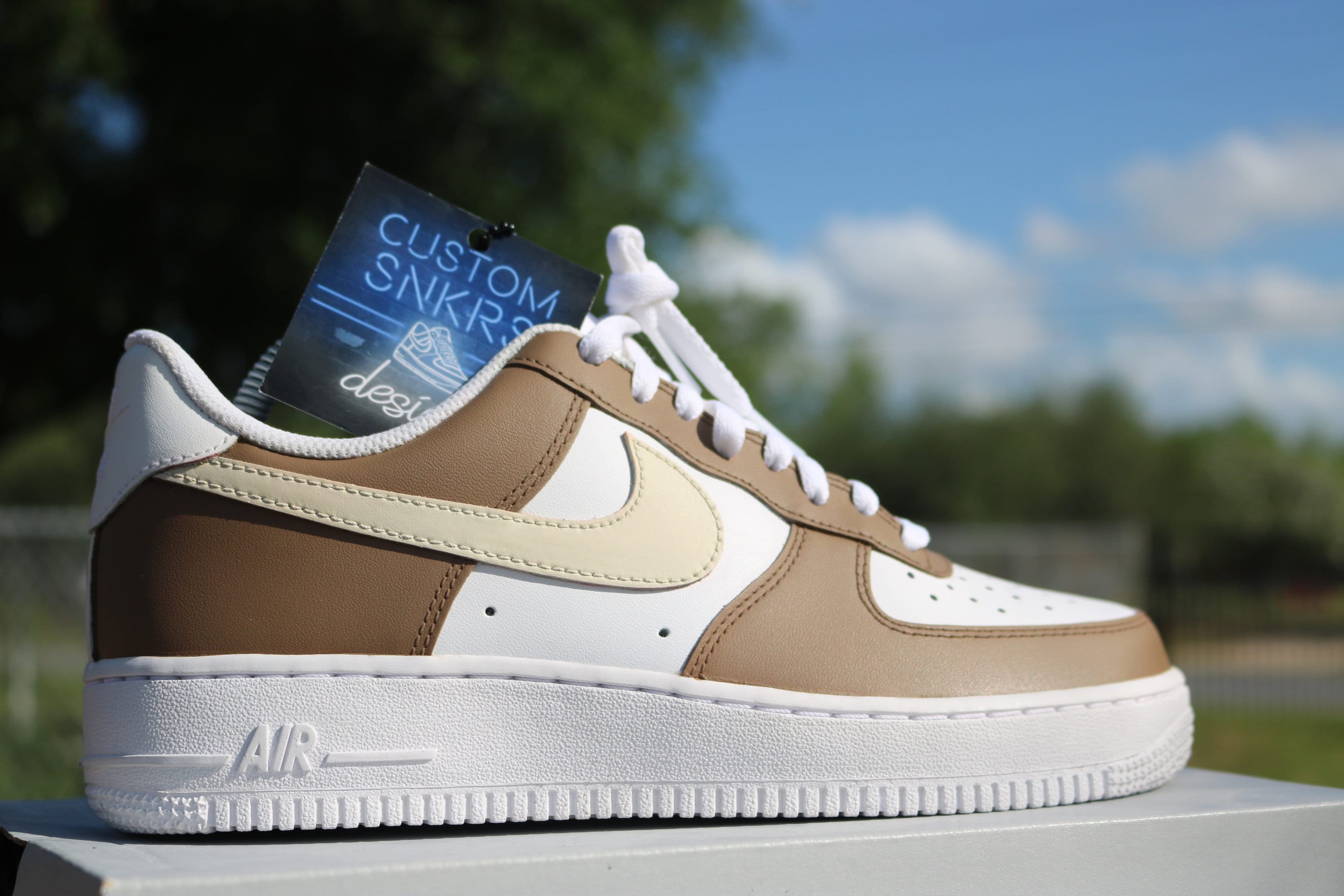 white and brown air force ones