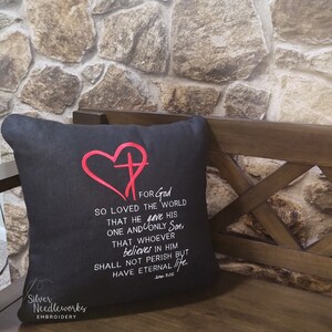 May include: Black throw pillow with red embroidered heart and cross, and the text "FOR God SO LOVED THE WORLD THAT HE gave HIS ONE AND ONLY Son, THAT WHOEVER believes IN HIM SHALL NOT PERISH BUT HAVE ETERNAL life. John 3:16"