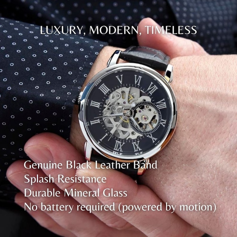 May include: A silver and black automatic wristwatch with Roman numeral hour markers and a black leather band. The watch face is skeletonized, revealing the inner workings of the movement. The watch is on a person's wrist. "LUXURY, MODERN, TIMELESS" is written at the top of the image. "Genuine Black Leather Band", "Splash Resistance", "Durable Mineral Glass", and "No battery required (powered by motion)" are written below the watch.