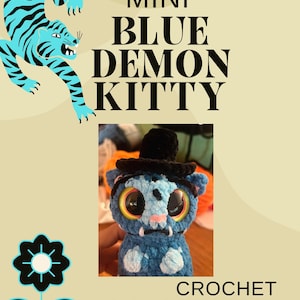 May include: An advertisement for a crochet pattern shows a blue demon kitty with a small black hat and large eyes. The text "MINI BLUE DEMON KITTY CROCHET PATTERN" is displayed on a beige background, with a blue tiger illustration.