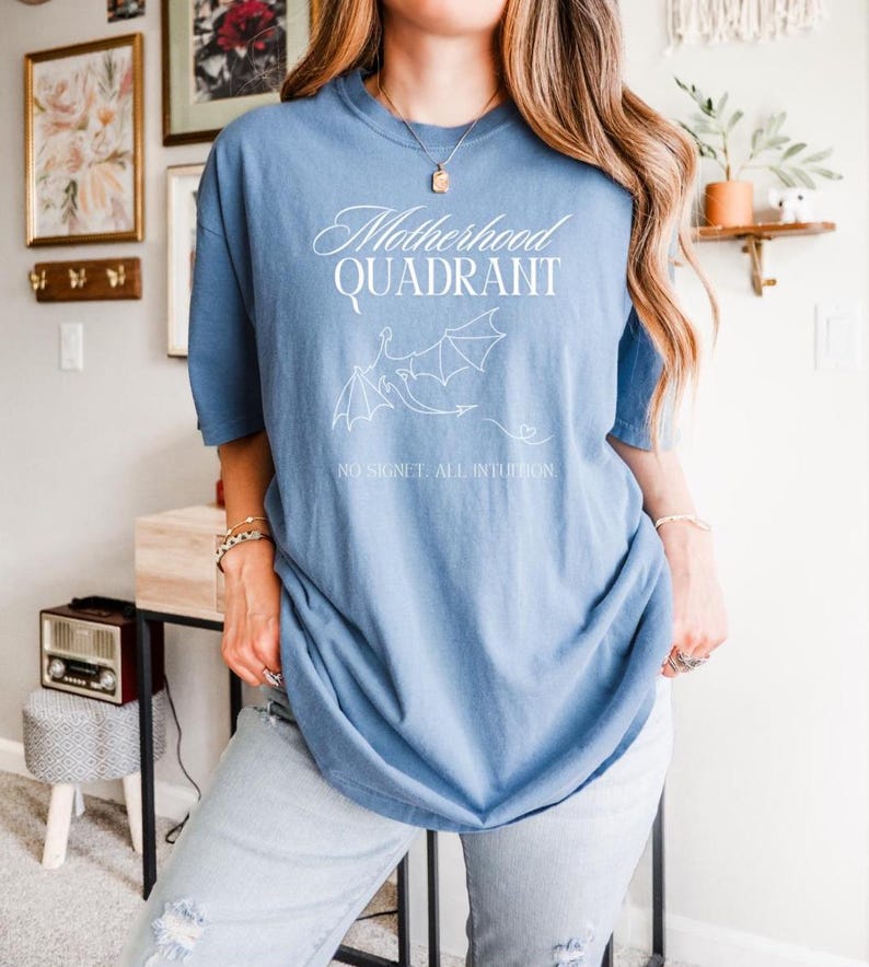A model wears a comfort to colors shirt in denim blue. It would be great for a mom who loves to read