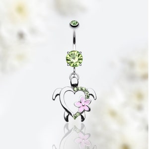 May include: Silver belly button ring with a green crystal and a dangling charm of a turtle with a pink flower and green crystals.