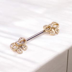 A set of Dainty Bow Tie Nipple Barbell