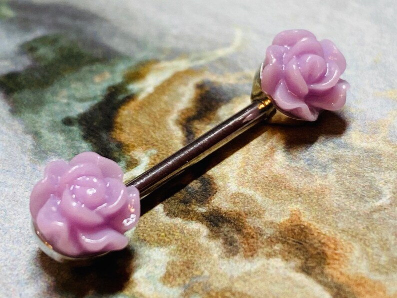 A set of Acrylic Rose Nipple Barbell