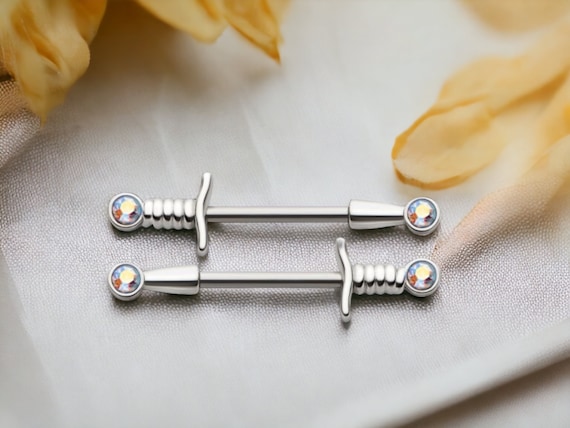 Piercing Pour Téton En Acier Chirurgical Avec Zirconium Rouge - Modèle Dague/poignard, Neuf Avec étiquettes