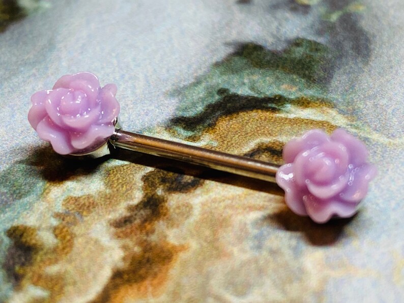 A set of Acrylic Rose Nipple Barbell