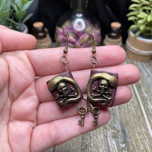 Dark spell book earrings/Wiccan and Pagan jewelry/Gothic earrings with a snake figure and skull/Handmade gift for witches,wizards, bookworms