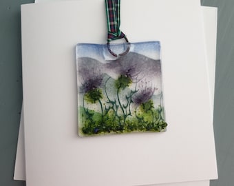 A "Wee Mindin" card and detachable Scottish Thistle hanging