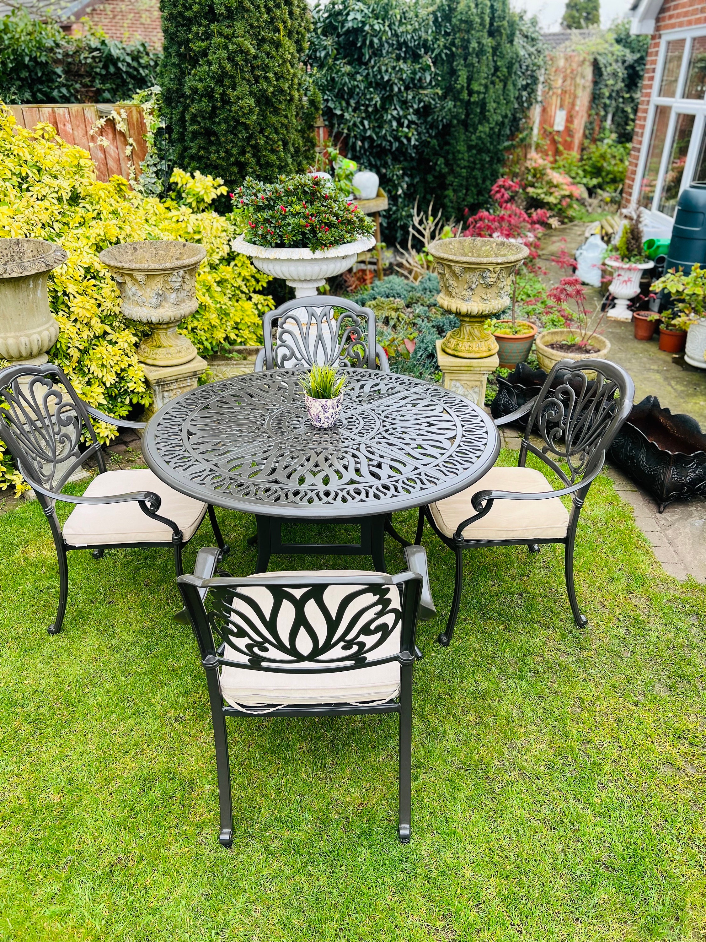 cast iron garden table and 4 chairs