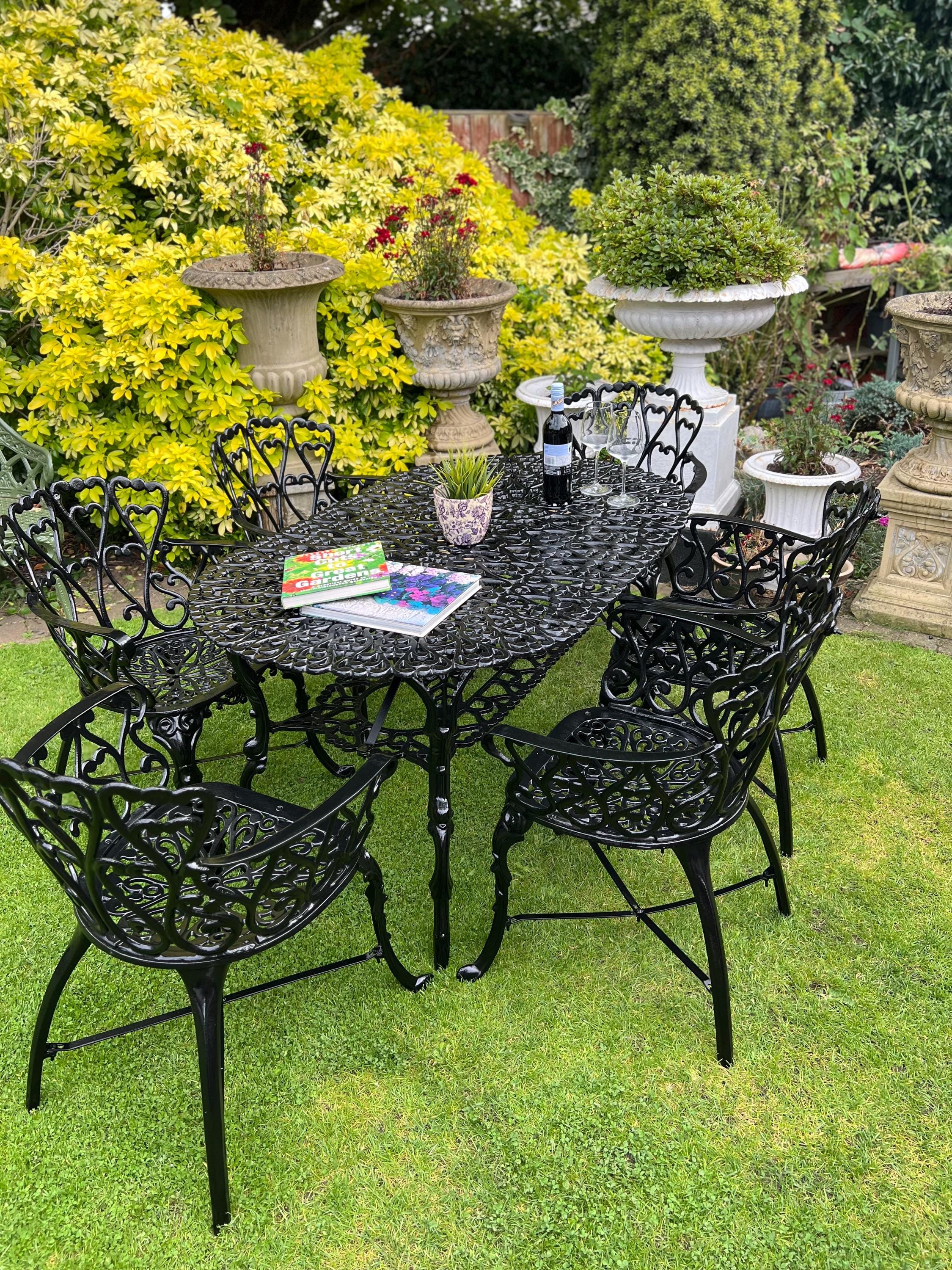 Rod iron chairs and table discount
