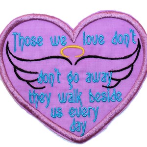 May include: Purple heart-shaped patch with embroidered wings and the text "Those we love don't go away, they walk beside us every day."