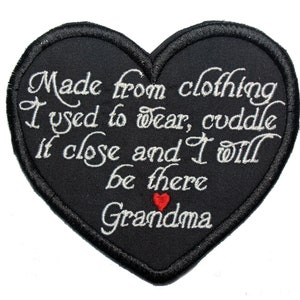 May include: Black heart-shaped patch with white embroidered text that reads "Made from clothing I used to wear, cuddle it close and I will be there Grandma". A small red heart is embroidered below the text.
