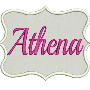 May include: A white, decorative, scalloped frame with a pink cursive font that reads "Athena".