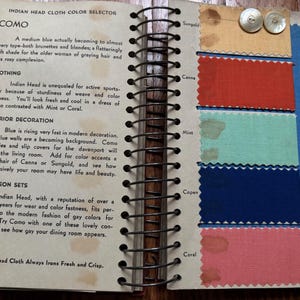 May include: A page from a fabric color selector book showing swatches of different colors of Indian Head cloth. The colors are: Sungold, Canna, Mint, Copen, and Coral. The text on the page reads: "Indian Head Cloth Color Selector, Como, A medium blue actually becoming to almost every type-both brunettes and blondes, a flatteringly soft shade for the older woman of graying hair and less rosy complexion."