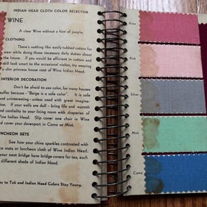 May include: A page from a vintage fabric color selector book. The page features the color "Wine" and shows swatches of different colors, including Rose, Pink, Silver, Mint, and Como. The text on the page describes the color Wine and suggests ways to use it in clothing, interior decoration, and luncheon sets.
