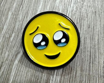 Teary eyed emoji enamel pin / face holding back tears emoji enamel pin