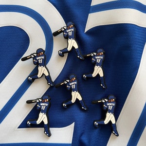 Puede incluir: Cinco figuras de jugadores de béisbol azul y blanco con el nombre "Richette" y el número "17" en la parte posterior de sus camisetas. Las figuras están en posición de bateo.