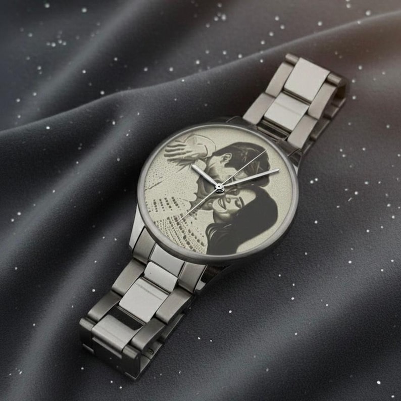 May include: A silver-toned wristwatch with a personalized watch face featuring a black and white image of a couple. The watch has a metallic band and a classic analog display.