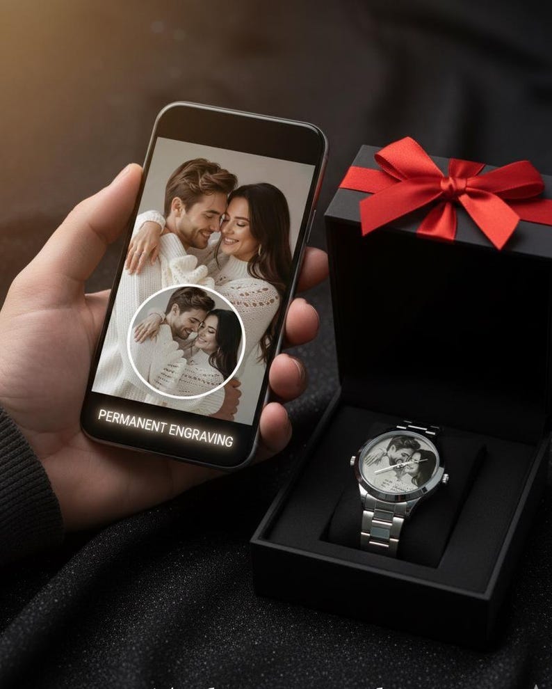 May include: A silver wristwatch with a photo of a couple on the watch face, displayed in a black gift box with a red bow. A smartphone shows the same photo with the text "PERMANENT ENGRAVING".