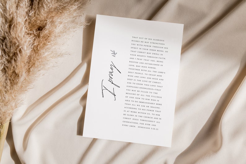 May include: A white card with a handwritten inscription "I pray" and a passage from Ephesians 3:16-21. The text reads: "That out of His glorious riches He may strengthen you with power through His Spirit in your inner being, so that Christ may dwell in your hearts through faith. And I pray that you, being rooted and established in love, may have power, together with all the Lord's holy people, to grasp how wide and long and high and deep is the love of Christ, and to know this love that surpasses knowledge&mdash;that you may be filled to the measure of all the fullness of God. Now to Him who is able to do immeasurably more than all we ask or imagine, according to His power that is at work within us, to Him be glory in the church and in Christ Jesus throughout all generations, for ever and ever. Amen. Ephesians 3:16-21"