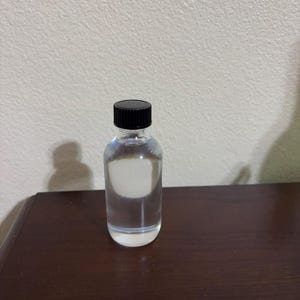2oz lwil 7 puissance, brillo, kapab, mil fleur, ginen, de rose, trankil, di mil lom, brillo traste (poderes) (aceite) de Ayiti