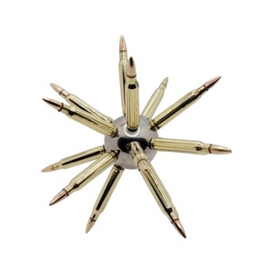 May include: A metal sphere with multiple gold-colored bullet casings protruding from it, forming a starburst pattern.