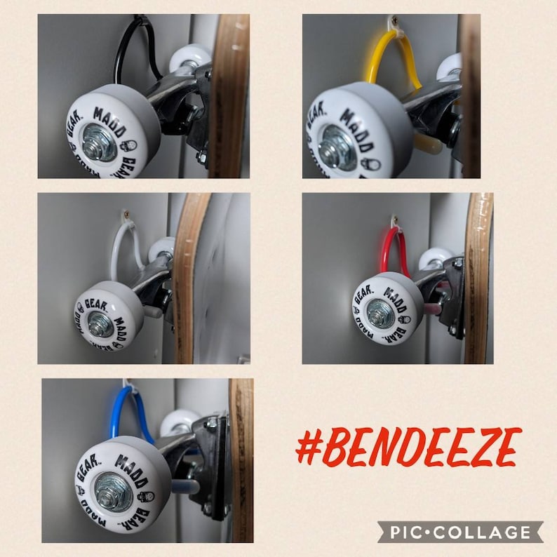 K&ouml;nnte beinhalten: Eine Collage von Skateboard-R&auml;dern mit dem Text "BEAR. MADDO" und verschiedenen farbigen Haken. Die R&auml;der sind grau mit schwarzem Text. Die Haken sind schwarz, gelb, wei&szlig;, rot und blau. Der Text "#BENDEEZE" ist rot.