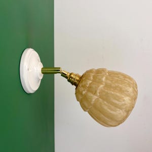 Vintage yellow Clichy glass globe wall light