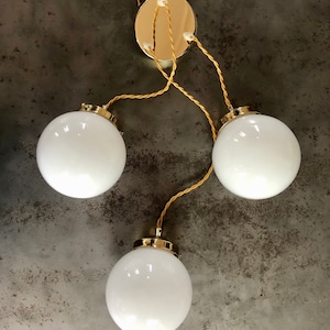 Three-light cascade pendant light, vintage white opaline globes