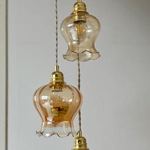 Triple vintage tulip pendant light in amber glass