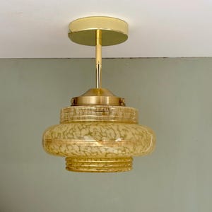 Vintage art deco globe pendant light / ceiling light in yellow Clichy glass