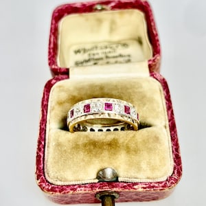 Vintage 9ct gold full eternity ring.  Size K1/2 . Synthetic ruby red stones & clear simulated diamonds. Hallmarked, 1970. 3.6grams.