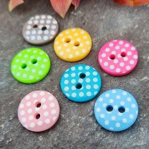 13mm spotty dotty prettyfull little buttons.  10 buttons per pack