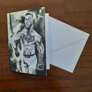 Conor Mcgregor a illustré la carte d’anniversaire de ma propre œuvre d’art originale, à l’intérieur lit « Joyeux anniversaire Champ ». Calibre A6