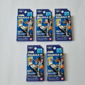 May include: A collection of five Digimon ID Plate 02 boxes. Each box features a blue and black design with Japanese text and illustrations of Digimon characters and a Digivice IC. The boxes are made in China.